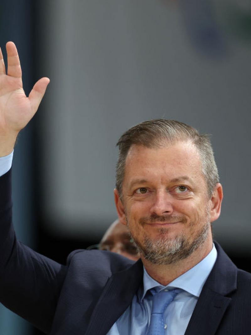 Andrew Parsons waves to the crowds at the Games