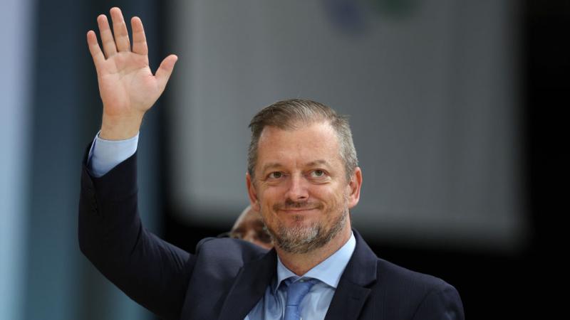 Andrew Parsons waves to the crowds at the Games