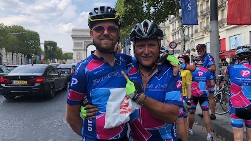 Martin Heggelund and his father standing in front of the Arc de Triomphe
