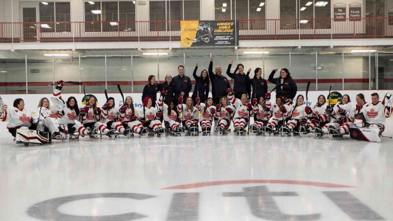 Players pose for a group picture after a match