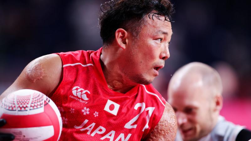 A close-up image of a male wheelchair rugby player